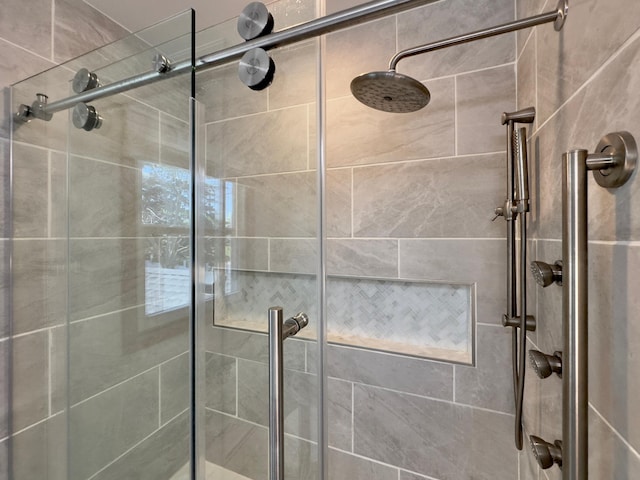 full bath featuring a shower stall