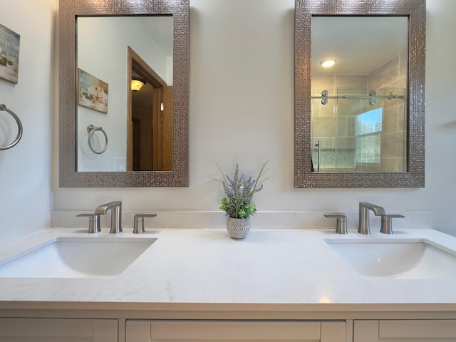 full bath featuring a stall shower and double vanity