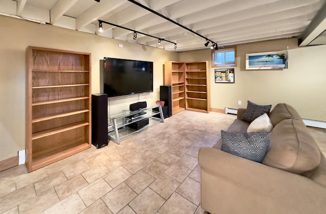 living room with track lighting, a baseboard heating unit, baseboards, and beamed ceiling