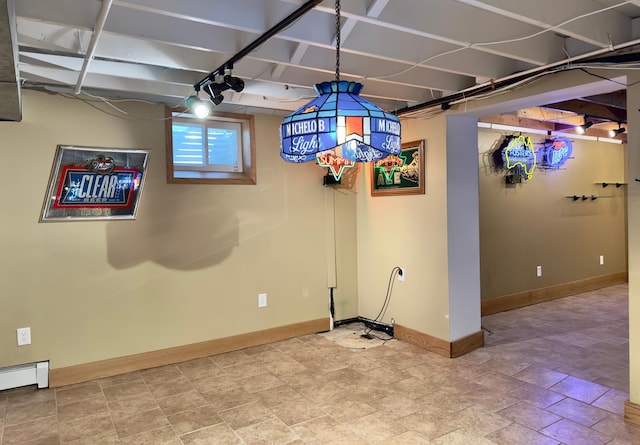 unfurnished dining area featuring baseboards and baseboard heating