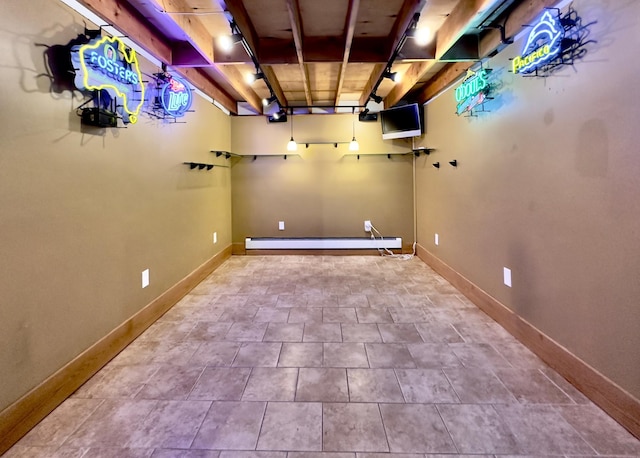 laundry area featuring baseboard heating and baseboards