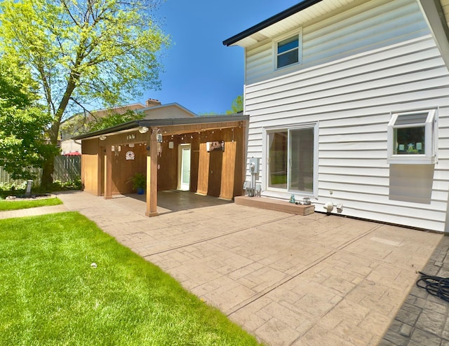 rear view of property featuring a patio