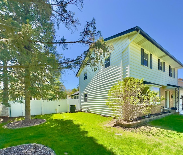 view of home's exterior with central AC