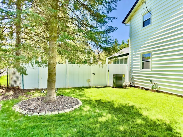 view of yard featuring central air condition unit