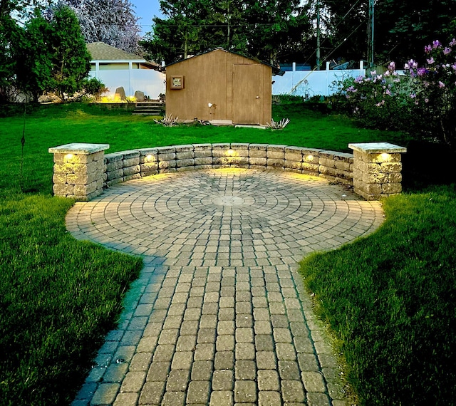 surrounding community with a patio area, a storage shed, and an outbuilding