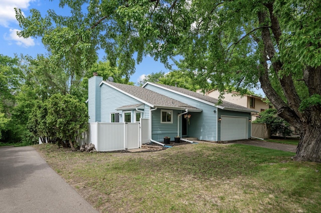 1428 Willow Creek Ln, Shoreview, MN 55126 - view of front of property with driveway, a chimney, a garage, and a shingled roof