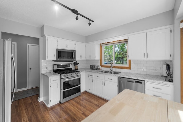 1428 Willow Creek Ln, Shoreview, MN 55126 - kitchen with stainless steel appliances, a sink, dark wood-style floors, and light stone countertops