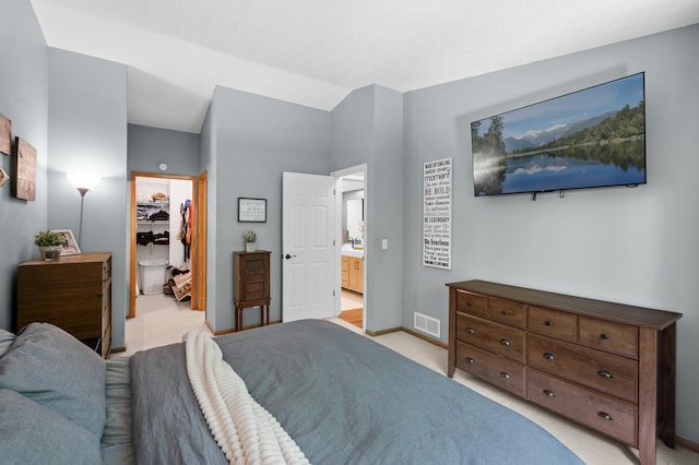 1428 Willow Creek Ln, Shoreview, MN 55126 - bedroom with a walk in closet, baseboards, a closet, and light carpet