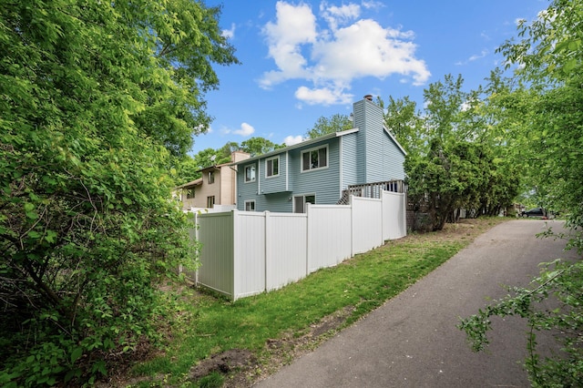 1428 Willow Creek Ln, Shoreview, MN 55126 - view of side of property featuring a chimney