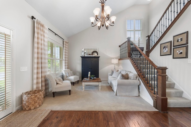 3121 Wild Flower Trl, Medina, MN 55340 - living room with stairway, wood finished floors, a chandelier, baseboards, and high vaulted ceiling