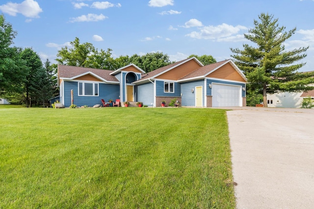 2820 Wilderness Ridge Rd SE, Alexandria, MN 56308 - view of front of house with an attached garage, a front lawn, driveway, roof with shingles, and brick siding