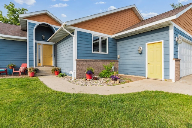 2820 Wilderness Ridge Rd SE, Alexandria, MN 56308 - view of front facade featuring an attached garage, a front yard, driveway, and brick siding