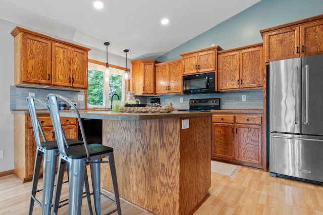 2820 Wilderness Ridge Rd SE, Alexandria, MN 56308 - kitchen featuring black appliances, brown cabinets, backsplash, vaulted ceiling, and light wood-style floors