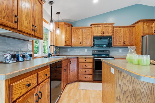 2820 Wilderness Ridge Rd SE, Alexandria, MN 56308 - kitchen with black appliances, vaulted ceiling, brown cabinetry, light wood-style floors, and tasteful backsplash