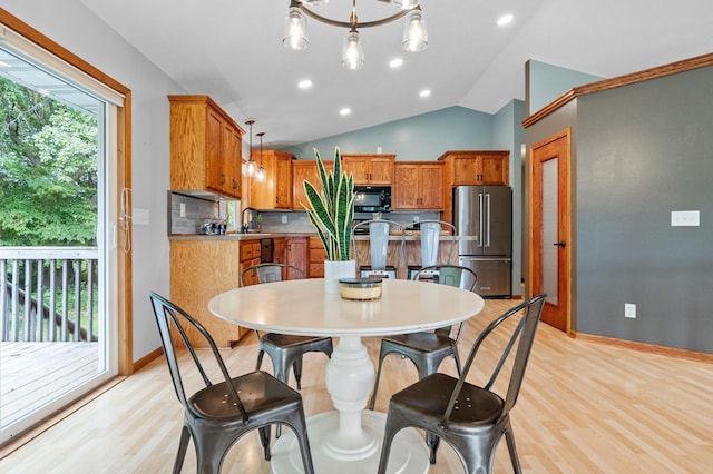 2820 Wilderness Ridge Rd SE, Alexandria, MN 56308 - dining area featuring light wood-type flooring, vaulted ceiling, recessed lighting, and a chandelier