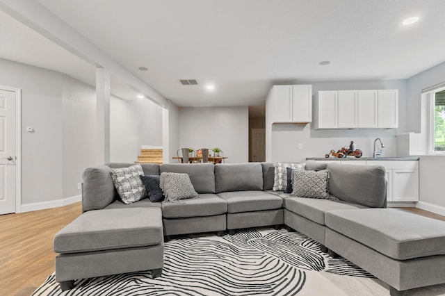 2820 Wilderness Ridge Rd SE, Alexandria, MN 56308 - living room with light wood-style flooring, recessed lighting, and stairway