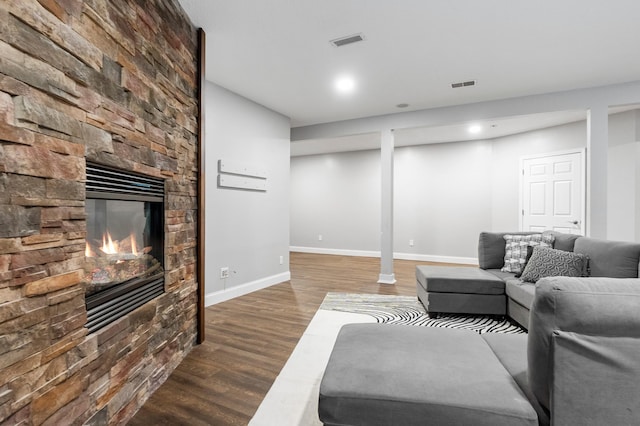 2820 Wilderness Ridge Rd SE, Alexandria, MN 56308 - living room with wood finished floors, a stone fireplace, and recessed lighting
