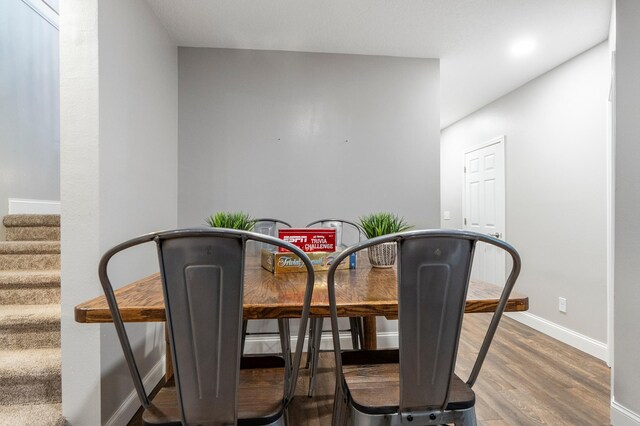 2820 Wilderness Ridge Rd SE, Alexandria, MN 56308 - unfurnished dining area featuring wood finished floors and stairs