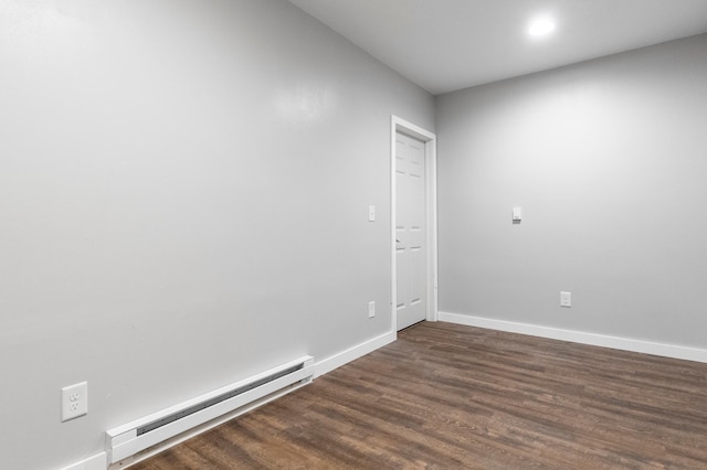 2820 Wilderness Ridge Rd SE, Alexandria, MN 56308 - spare room with a baseboard heating unit and dark wood-style flooring