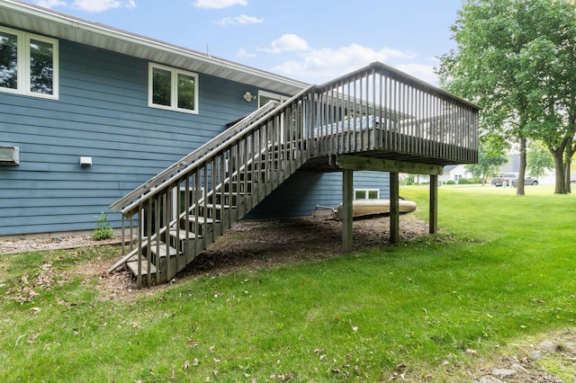 2820 Wilderness Ridge Rd SE, Alexandria, MN 56308 - rear view of house with a lawn, a wooden deck, and stairway