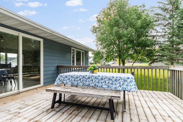 2820 Wilderness Ridge Rd SE, Alexandria, MN 56308 - wooden terrace featuring outdoor dining space and a lawn