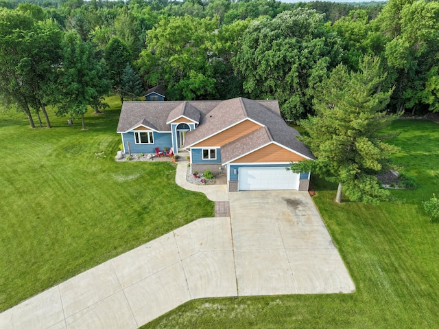 2820 Wilderness Ridge Rd SE, Alexandria, MN 56308 - view of front of house featuring concrete driveway, a front lawn, and an attached garage