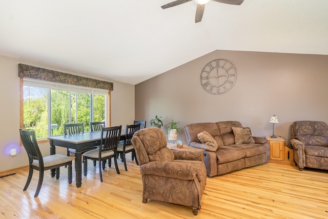 6609 210th Ln N, Forest Lake, MN 55025 - living room featuring light wood-style floors, lofted ceiling, and a ceiling fan