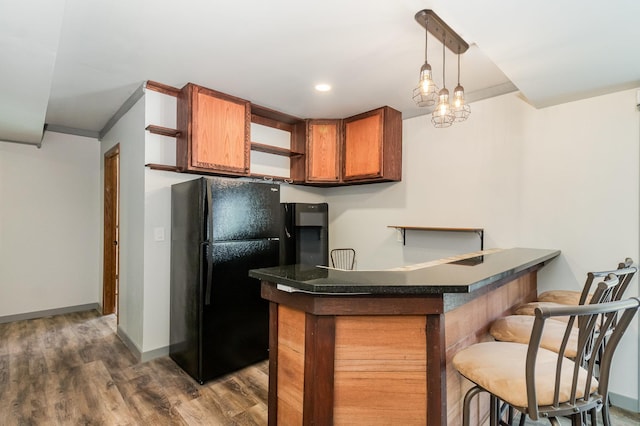 6609 210th Ln N, Forest Lake, MN 55025 - kitchen featuring open shelves, freestanding refrigerator, brown cabinetry, dark countertops, and a peninsula