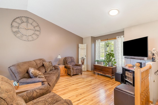 6609 210th Ln N, Forest Lake, MN 55025 - living room featuring light wood finished floors and lofted ceiling