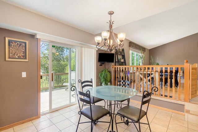 6609 210th Ln N, Forest Lake, MN 55025 - dining room featuring plenty of natural light, a chandelier, light tile patterned floors, and lofted ceiling