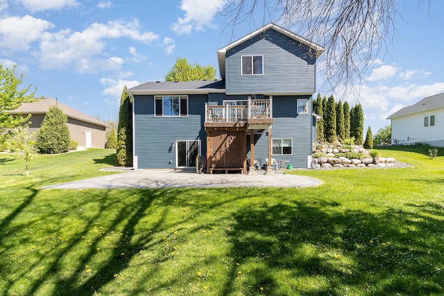 6609 210th Ln N, Forest Lake, MN 55025 - rear view of house with a patio area, a lawn, and a deck
