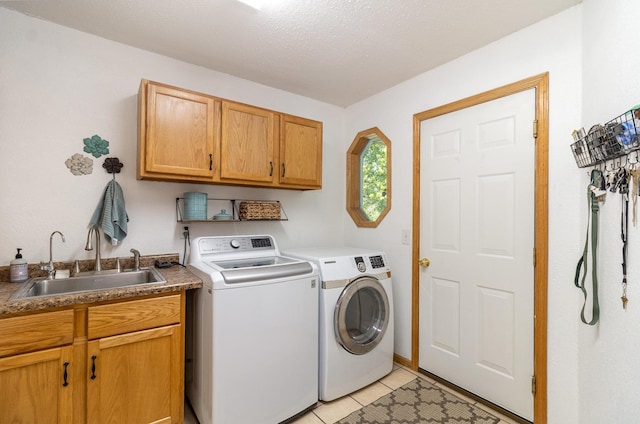 6609 210th Ln N, Forest Lake, MN 55025 - laundry area with cabinet space, washer and clothes dryer, and light tile patterned floors