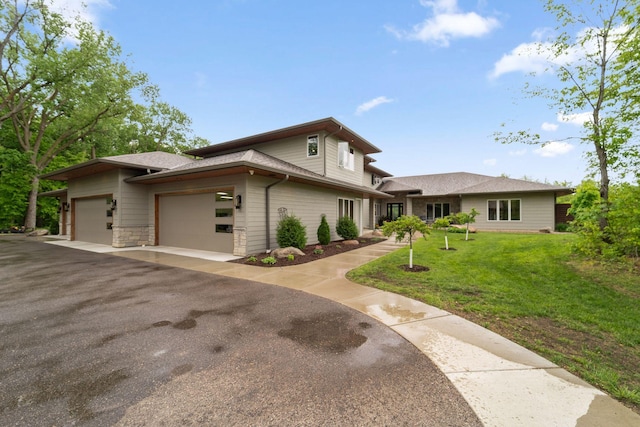 18565 Revere Ave, Spring Lake Twp, MN 55372 - view of front of home featuring a garage, a front lawn, driveway, and a shingled roof