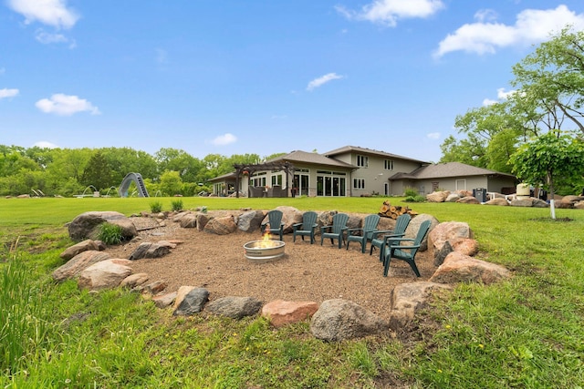 18565 Revere Ave, Spring Lake Twp, MN 55372 - back of property with a fire pit and a yard