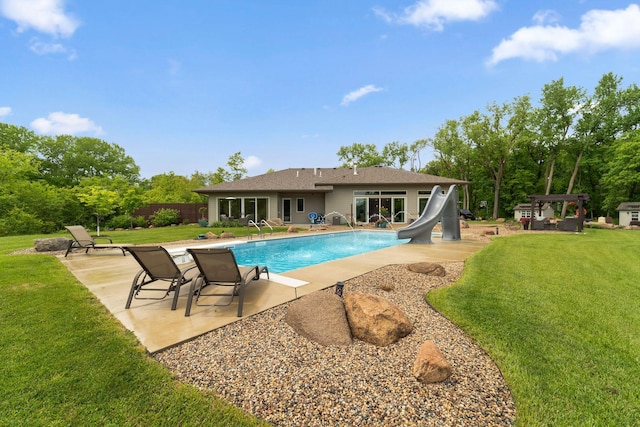 18565 Revere Ave, Spring Lake Twp, MN 55372 - view of swimming pool with a water slide, a patio area, a pergola, and a lawn