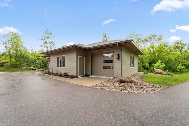 18565 Revere Ave, Spring Lake Twp, MN 55372 - view of front of home featuring asphalt driveway and a garage