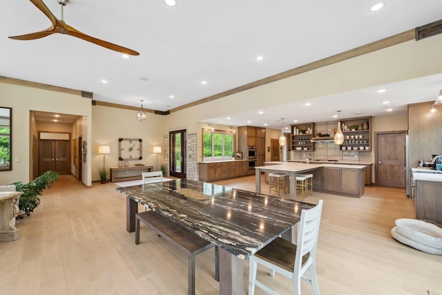 18565 Revere Ave, Spring Lake Twp, MN 55372 - dining area featuring light wood-type flooring, ornamental molding, recessed lighting, and ceiling fan