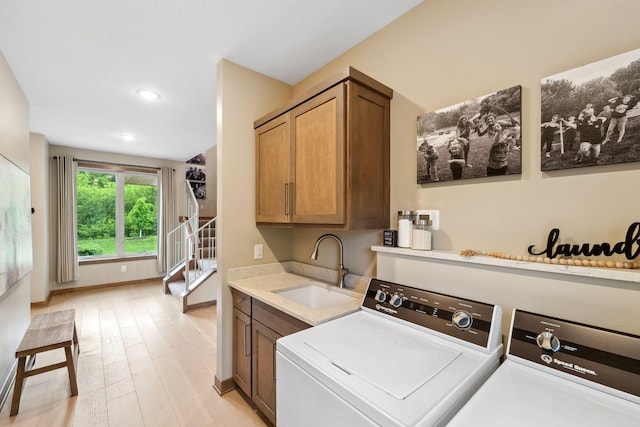 18565 Revere Ave, Spring Lake Twp, MN 55372 - laundry room with cabinet space, separate washer and dryer, light wood-type flooring, baseboards, and recessed lighting