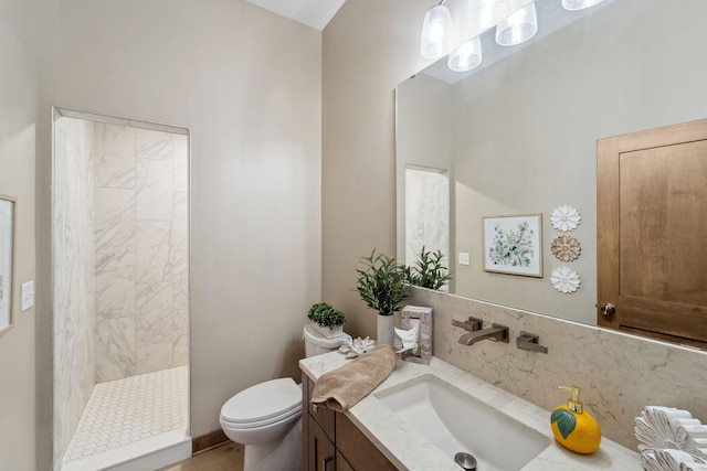18565 Revere Ave, Spring Lake Twp, MN 55372 - bathroom featuring toilet, vanity, a tile shower, and wood finished floors