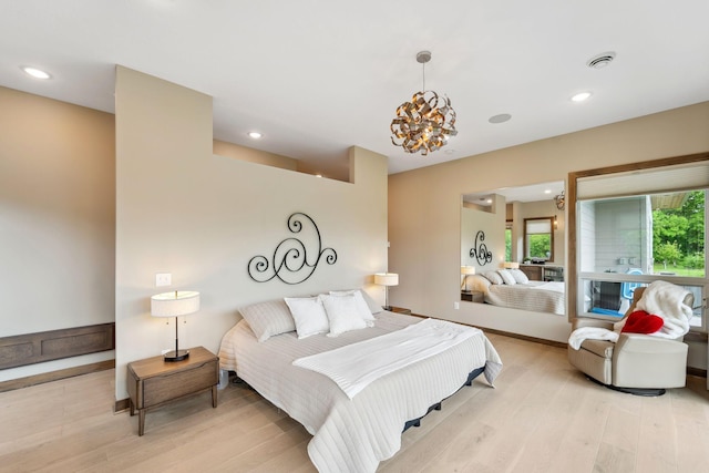 18565 Revere Ave, Spring Lake Twp, MN 55372 - bedroom with light wood-type flooring, recessed lighting, a chandelier, and baseboards