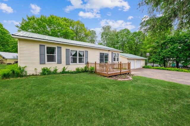 2628 River Rd, Sterling Twp, WI 54024 - single story home with a garage, a front yard, metal roof, an outbuilding, and a wooden deck
