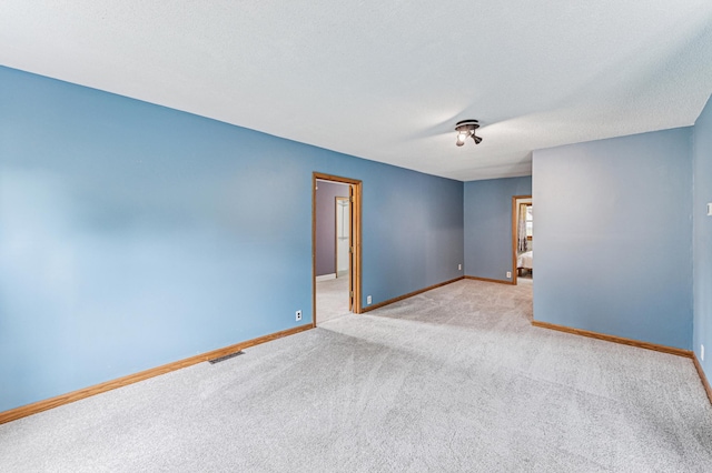 2628 River Rd, Sterling Twp, WI 54024 - empty room featuring carpet flooring and baseboards