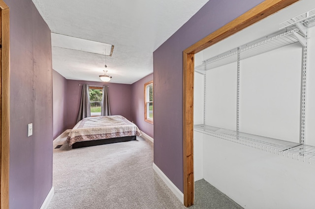 2628 River Rd, Sterling Twp, WI 54024 - carpeted bedroom featuring attic access and baseboards