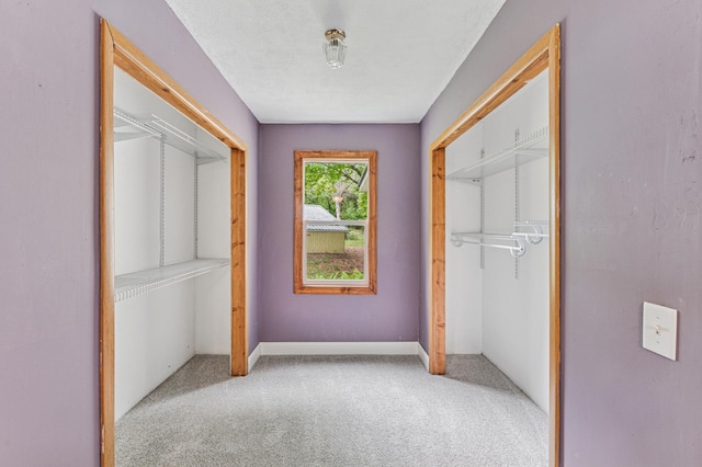 2628 River Rd, Sterling Twp, WI 54024 - unfurnished bedroom featuring light carpet, a closet, and baseboards
