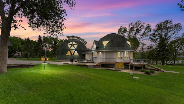 9630 Walleye Rd NW, Brandon, MN 56315 - back of property at dusk with a yard, a deck, and stairs