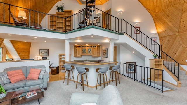 9630 Walleye Rd NW, Brandon, MN 56315 - kitchen with a high ceiling, carpet floors, recessed lighting, and wood walls