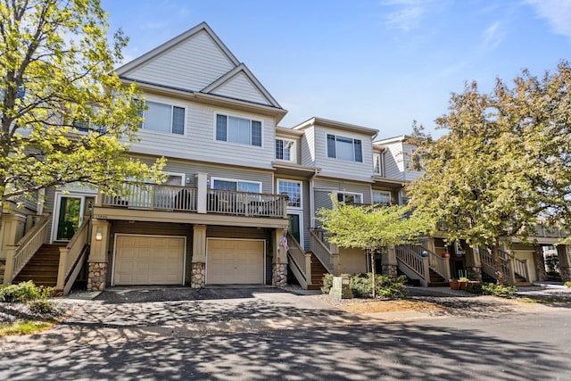 13848 52nd Ave N, Plymouth, MN 55446 - townhome / multi-family property featuring stairway, a garage, driveway, and stone siding