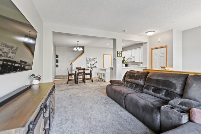 13848 52nd Ave N, Plymouth, MN 55446 - carpeted living room with a chandelier and a textured ceiling
