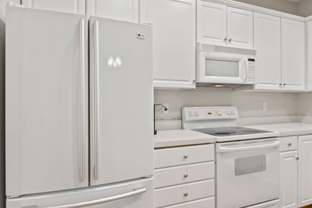 13848 52nd Ave N, Plymouth, MN 55446 - kitchen with white appliances, white cabinetry, and light countertops