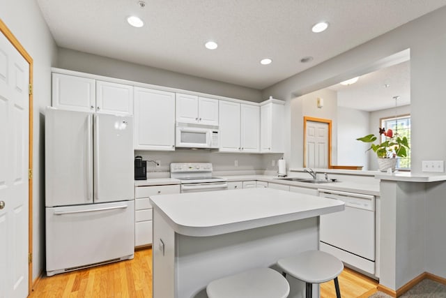 13848 52nd Ave N, Plymouth, MN 55446 - kitchen featuring white appliances, light countertops, white cabinets, a sink, and recessed lighting